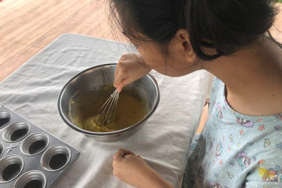 miss a making a cupcake batter